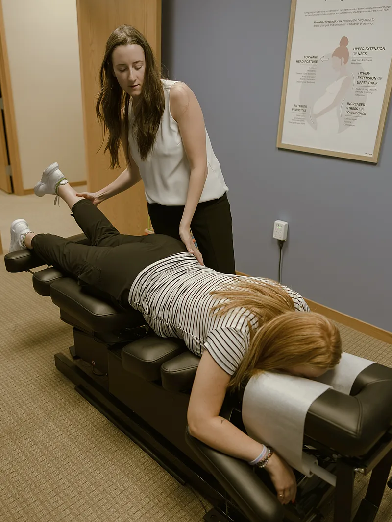 Dr. Moriah performing a leg raise assessment on a patient